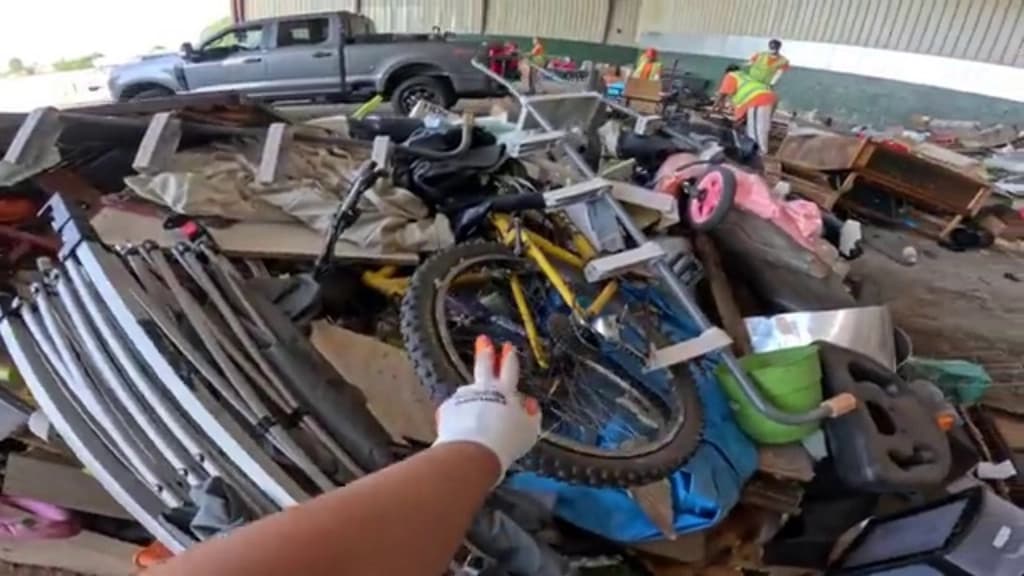 Metal and electronics scrap sorted into separate piles at a recycling facility