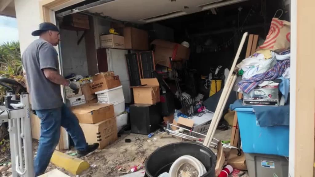 Cluttered two-car residential garage before a cleanout