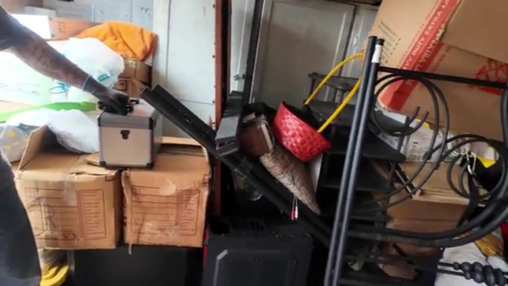 Storage boxes and a bed frame in a residential room