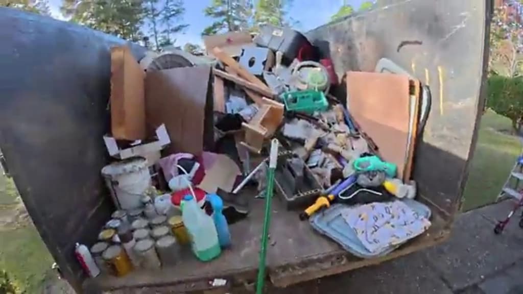 Truck bed filled with furniture and household items, showing how much space a load takes